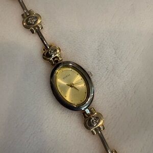 Guess Women's Gold Dial and Silver Bracelet Watch